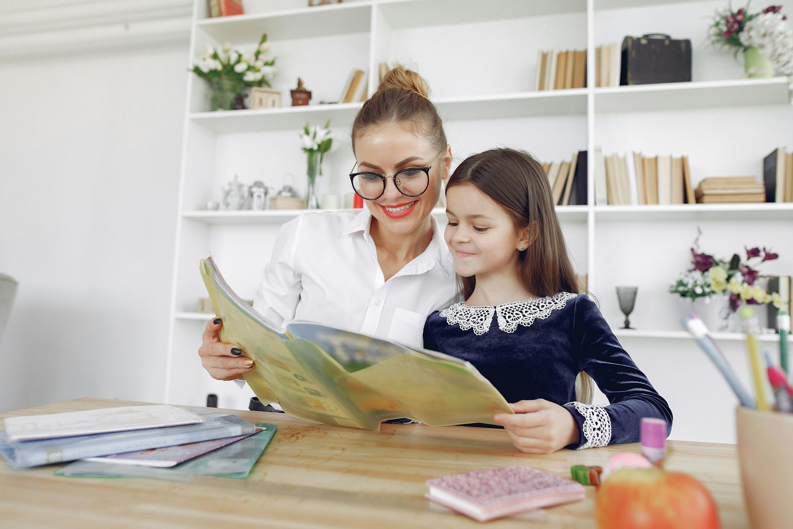 Teacher supporting a young student in an affordable international school in KL, nurturing early learning with care