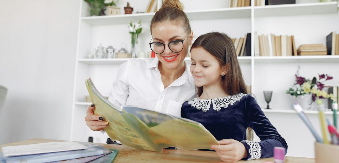 Teacher supporting a young student in an affordable international school in KL, nurturing early learning with care